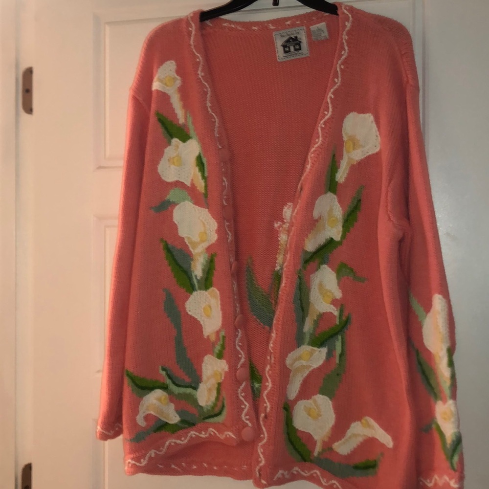 pink sweater with white flowers